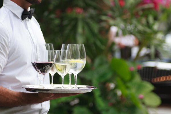 Barmen serving beverages to party guests